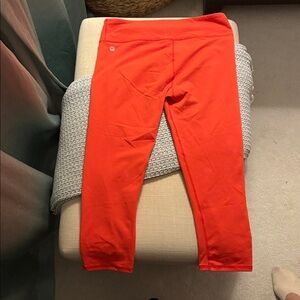 EUC Fabletics orange mid-rise power hold cropped pants